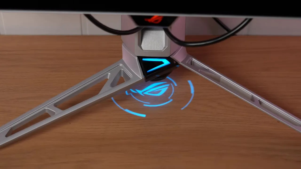 Peana en trípode del Asus ROG Swift PG27AQWP-W con iluminación azul y punto de fijación