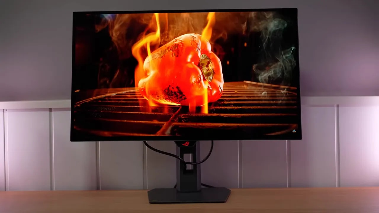 Asus ROG XG27AQWMG en modo glossy mostrando una escena HDR con fuego y humo