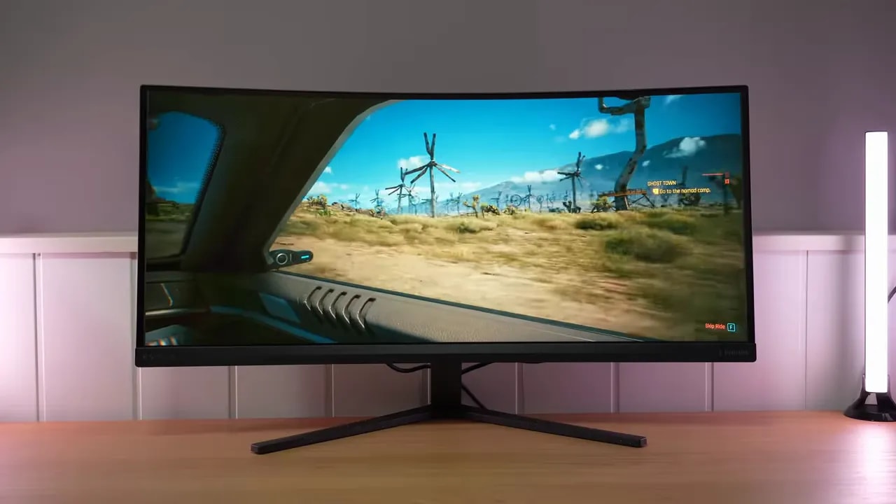 Vista del Philips Evnia 34M2C3500L con escena de juego en ultrawide curvo